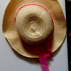 Wicked hat with a pink ribbon bow